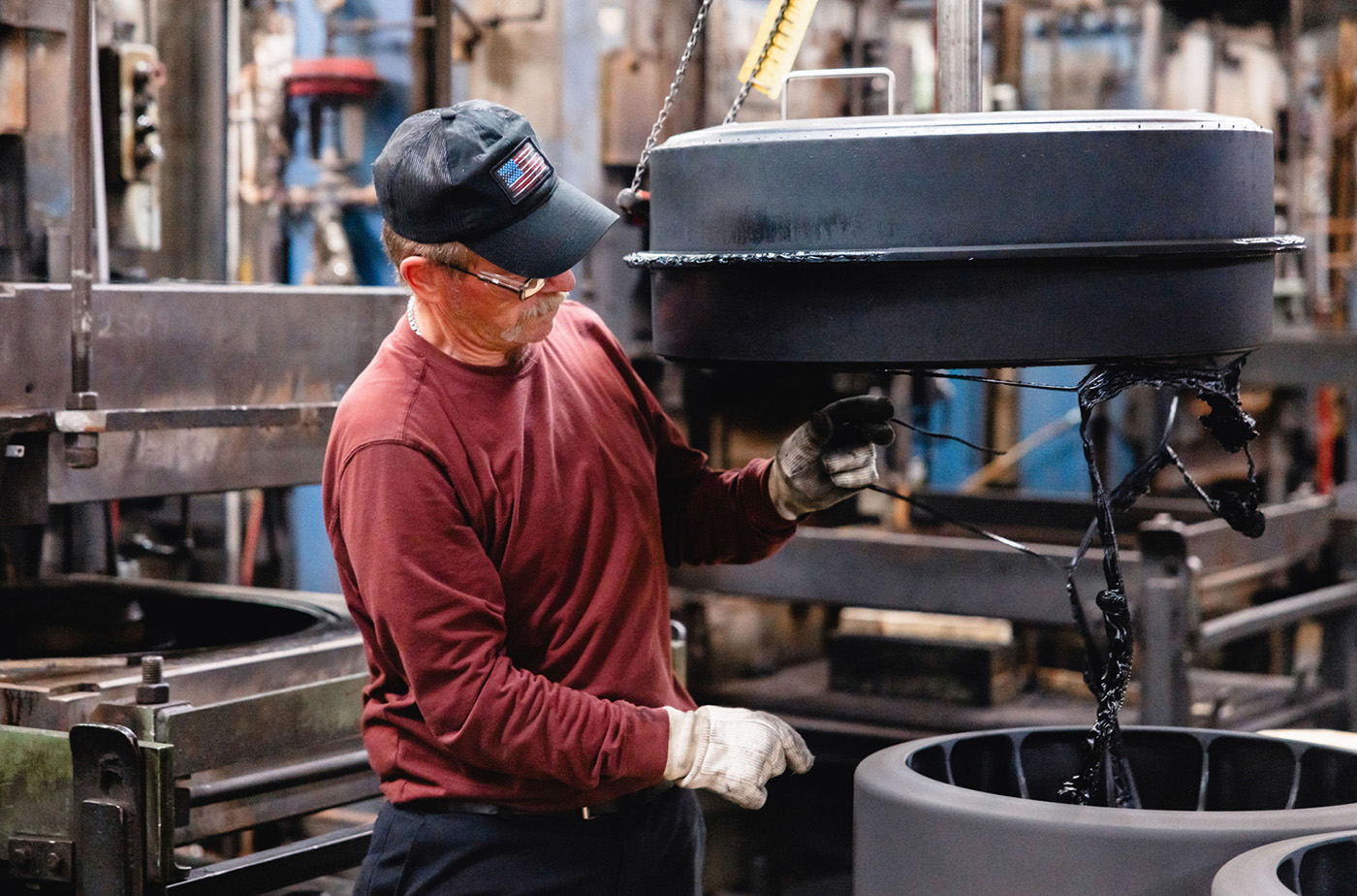 Trackman employee working on wheels in manufacturing facility